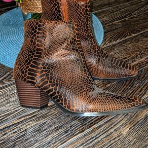 Coconuts Brown snake print boots.